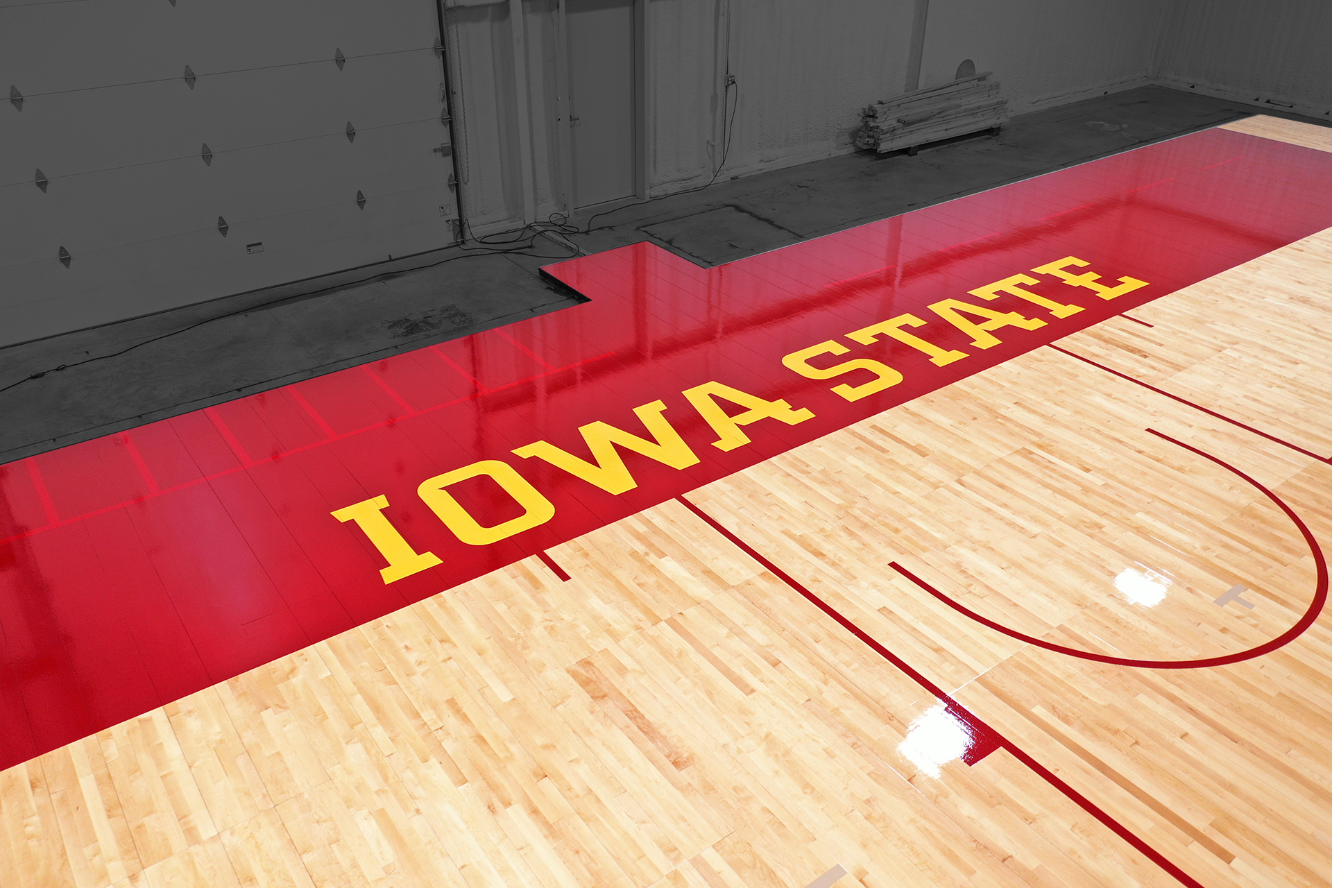 Paint on Paint Iowa State University basketball court baseline.